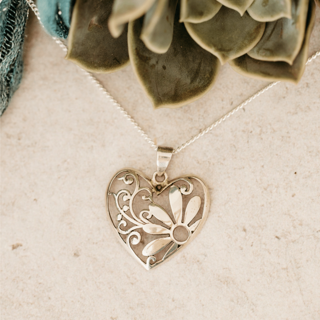 Sterling Silver Heart Shaped Pendant with Daisy