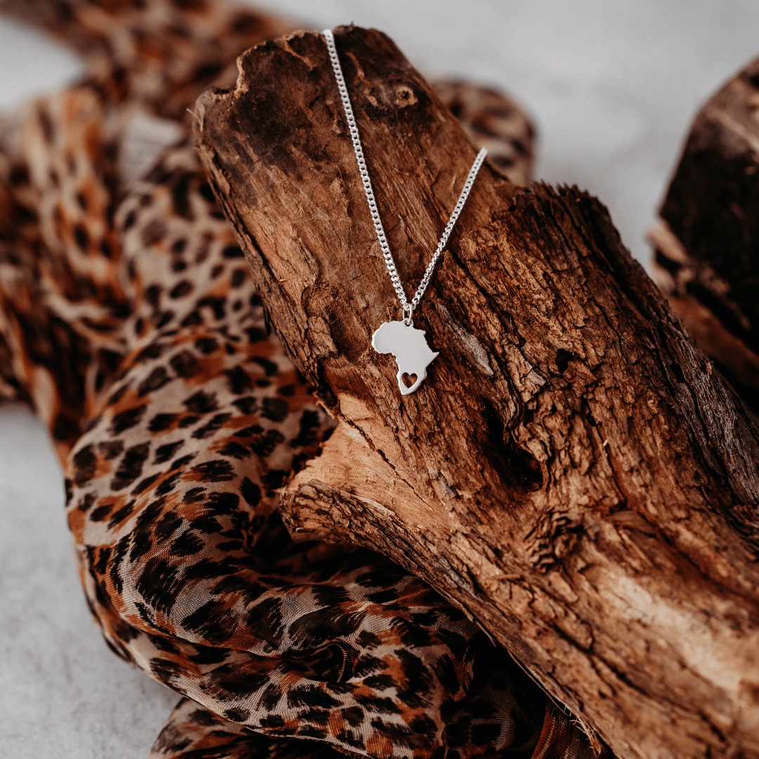 Sterling Silver Africa Pendant Necklace with Heart Cut-Out