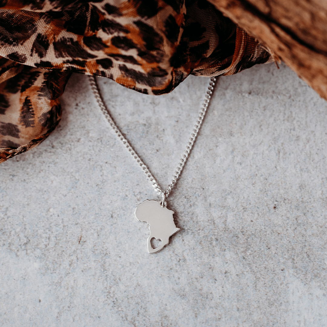Sterling Silver Africa Pendant Necklace with Heart Cut-Out