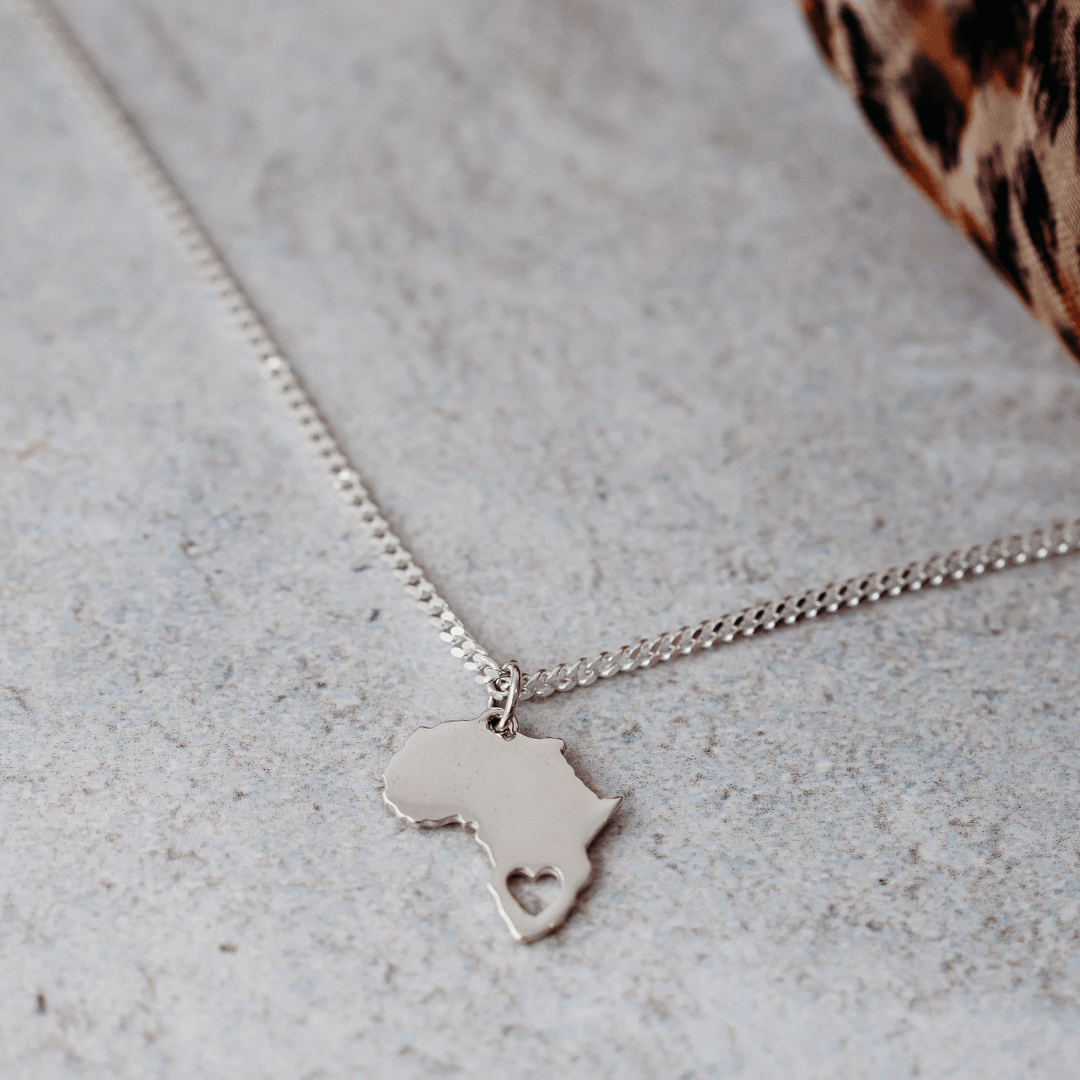 Sterling Silver Africa Pendant Necklace with Heart Cut-Out